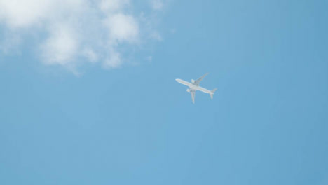 Low-Angle-Shot-Looking-Up-at-Plane-In-Sky